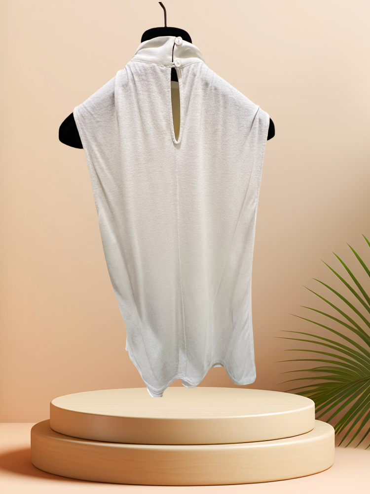 Seventy Blouse in creamy color, made from 70% viscose and 30% lana wool, displayed on a hanger with a minimalistic background.